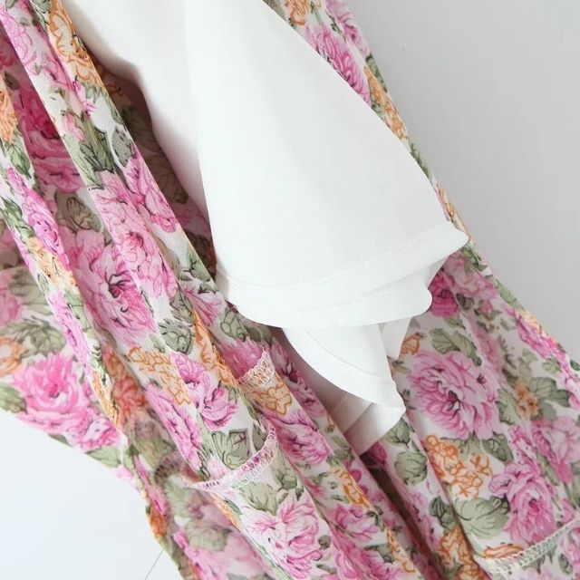 Mia - maxi-jurk met bloemenprint, spaghettibandjes en knoopdetail